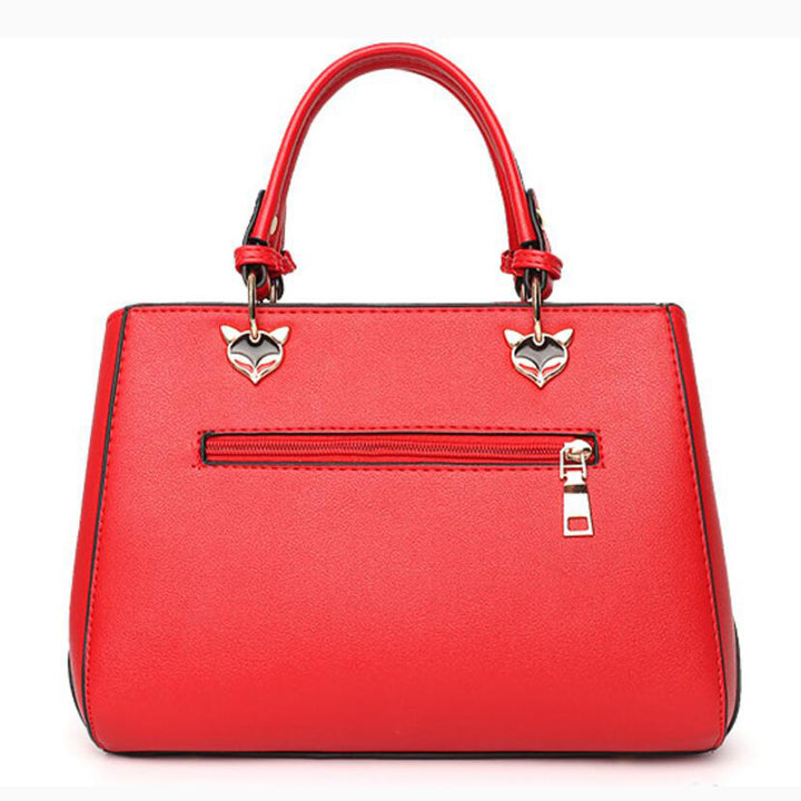 Colour-block handbag with pompom charm