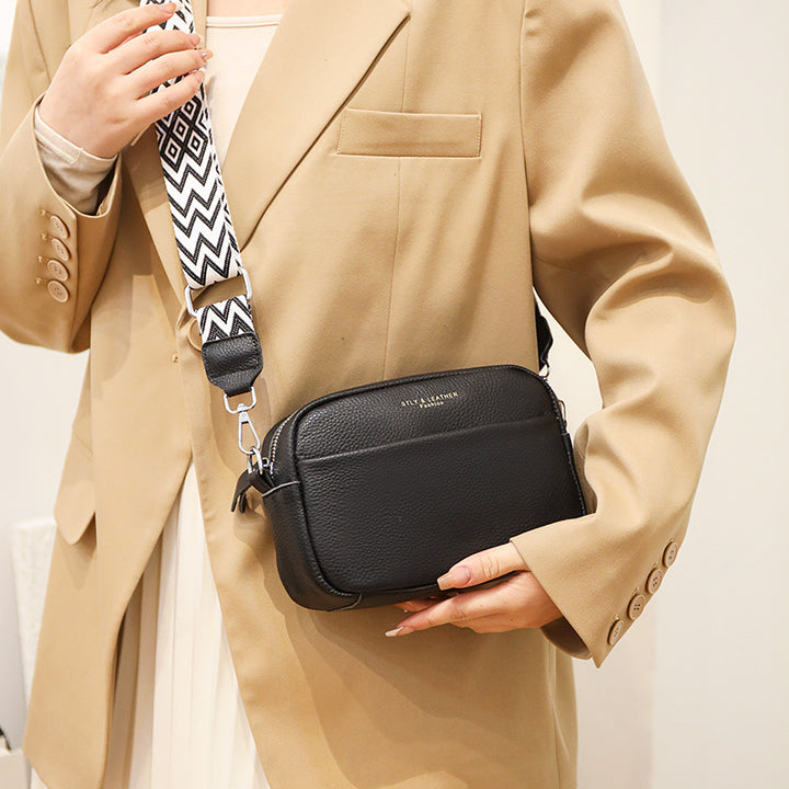 Small leather crossbody bag with patterned strap