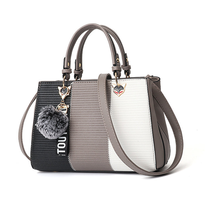 Isla | Colour-block handbag with pompom charm