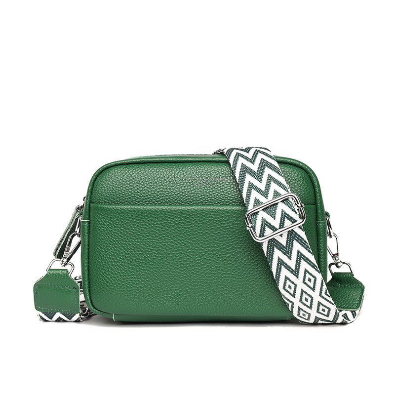 Small leather crossbody bag with patterned strap