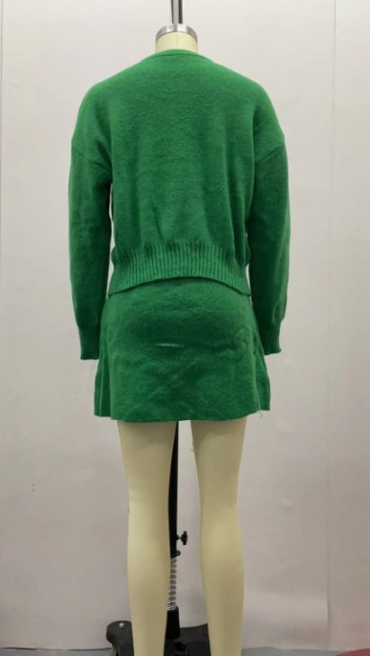 Woman in matching knitted jumper and mini skirt