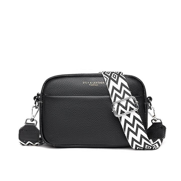 Small leather crossbody bag with patterned strap