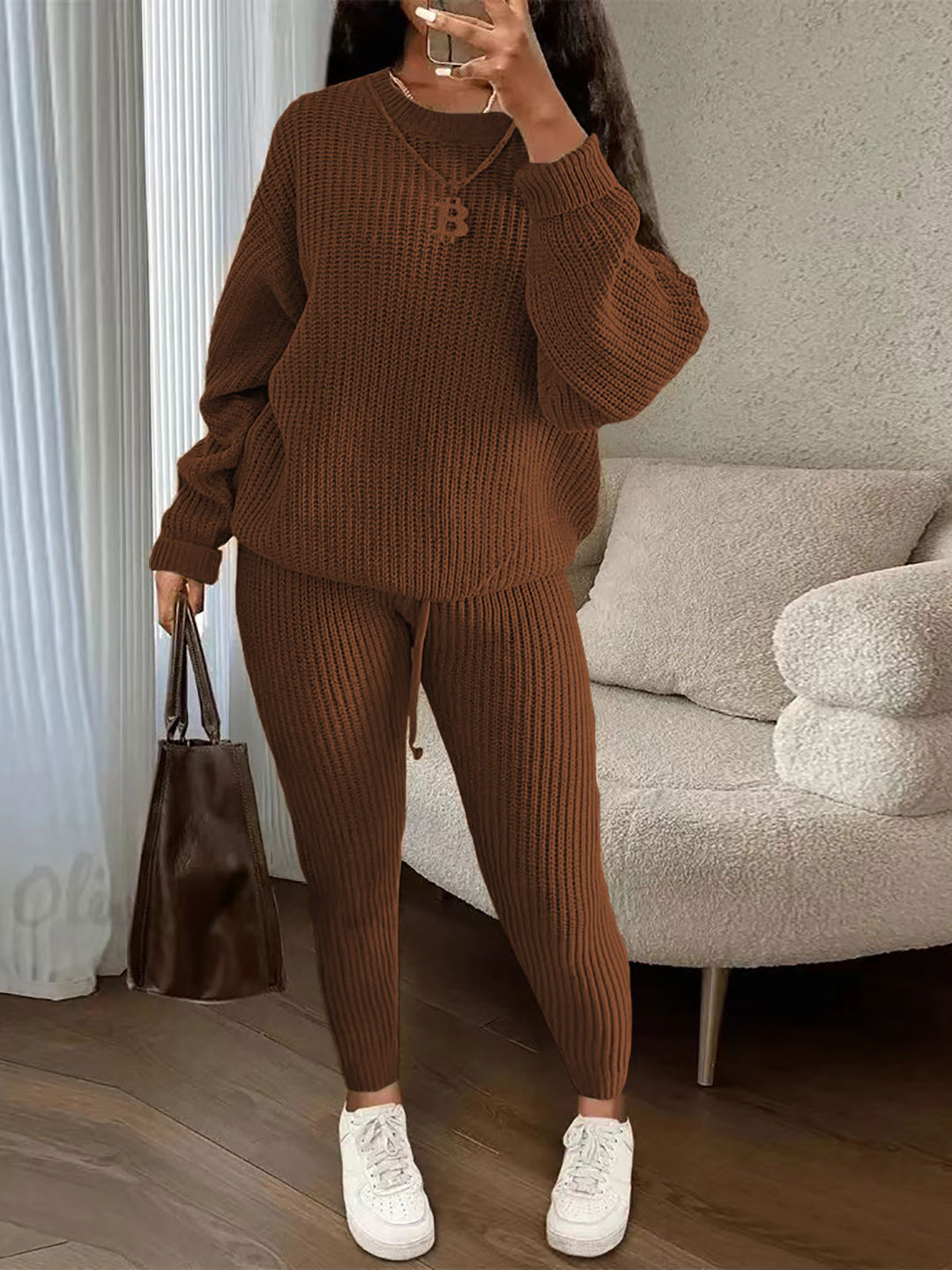 Woman in ribbed knit jumper and trousers set