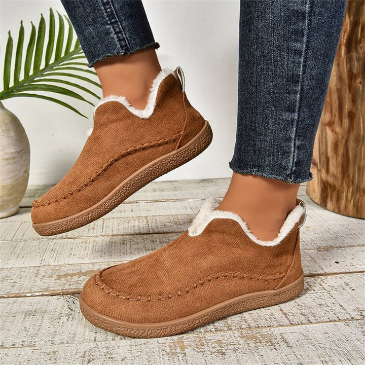 Flat faux suede ankle boots with V-cut