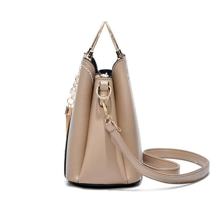 Colour block handbag with heart tassel