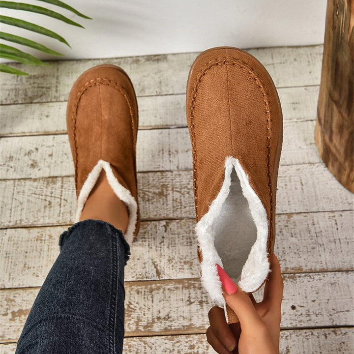 Flat faux suede ankle boots with V-cut