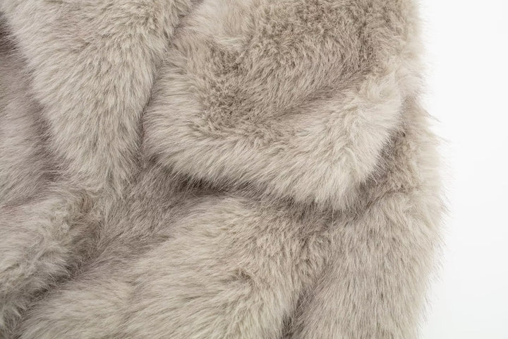 Woman in cropped fluffy faux fur jacket