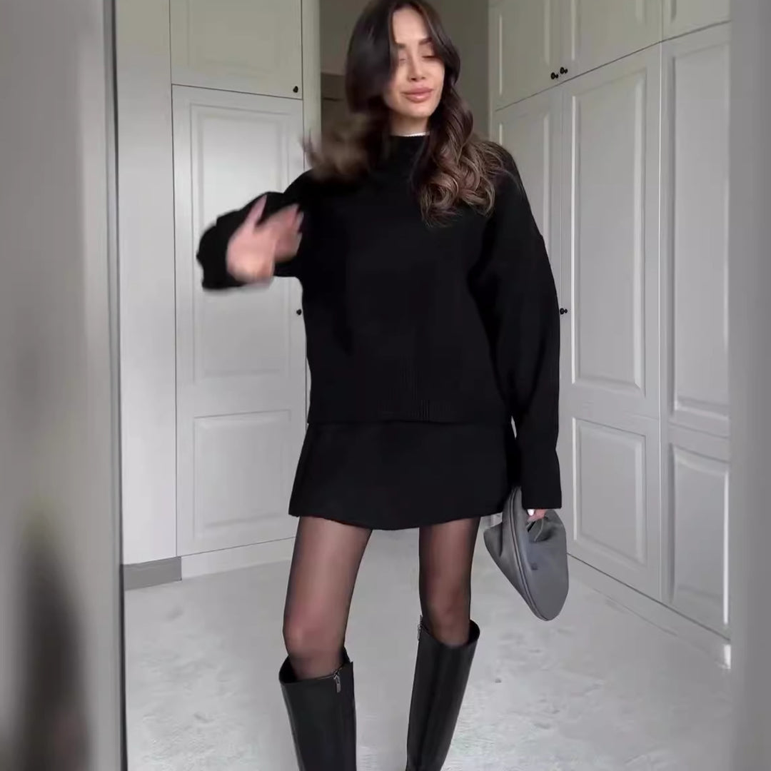 Woman in matching knitted jumper and mini skirt
